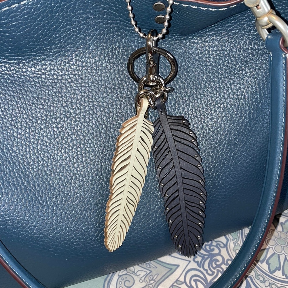 Coach feather charm